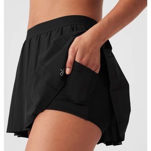 Alo Yoga black pleated tennis skirt.